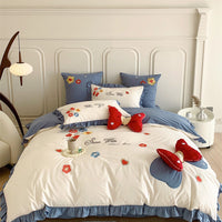 Ruffled Quilted Bedding Set with Embroidered Flower Appliqués and Decorative Bow Cushions