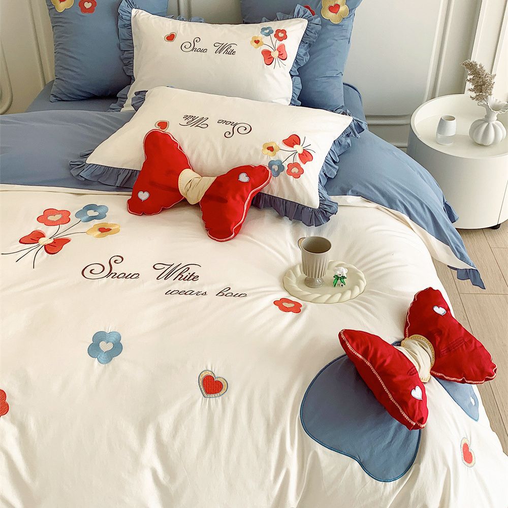 Ruffled Quilted Bedding Set with Embroidered Flower Appliqués and Decorative Bow Cushions