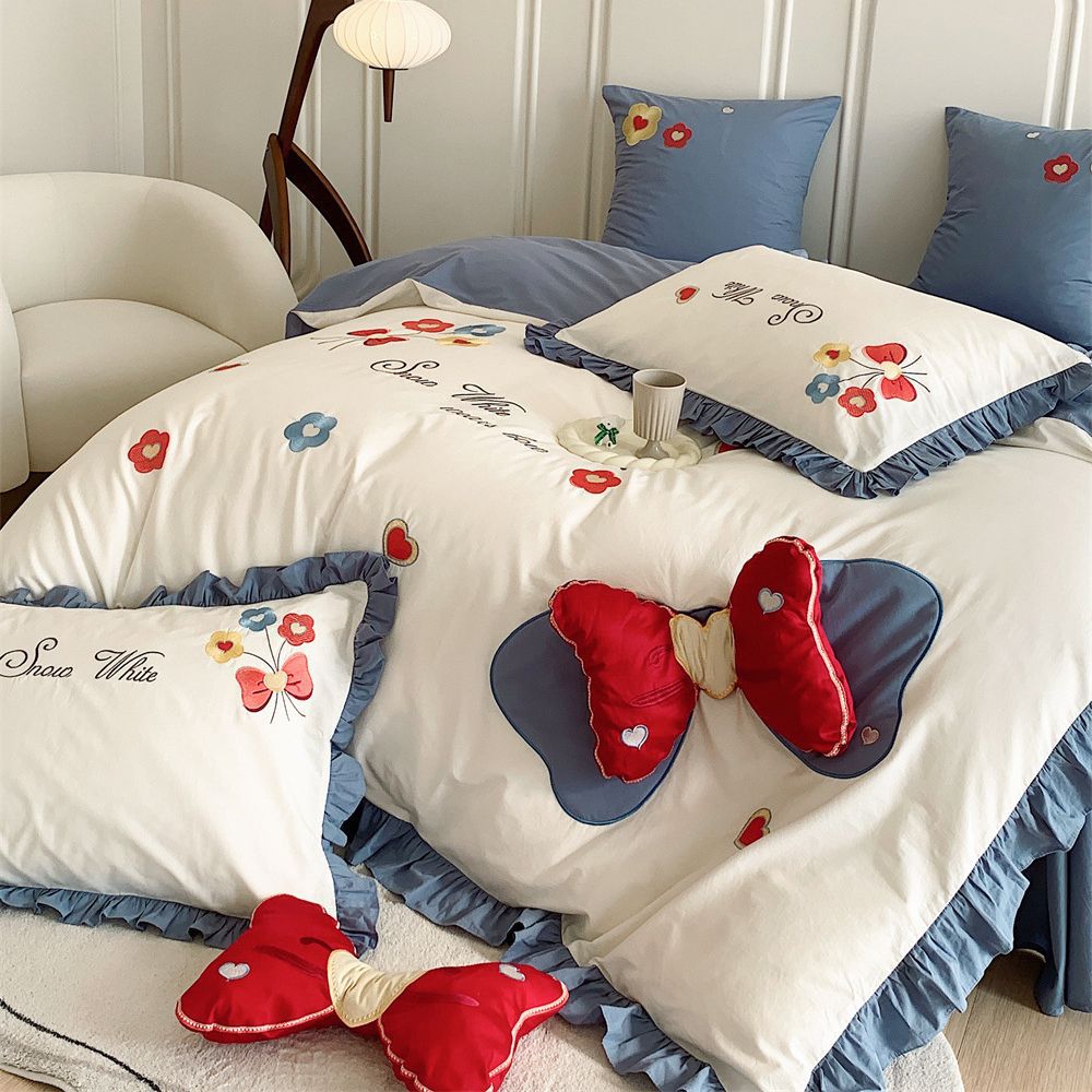 Ruffled Quilted Bedding Set with Embroidered Flower Appliqués and Decorative Bow Cushions