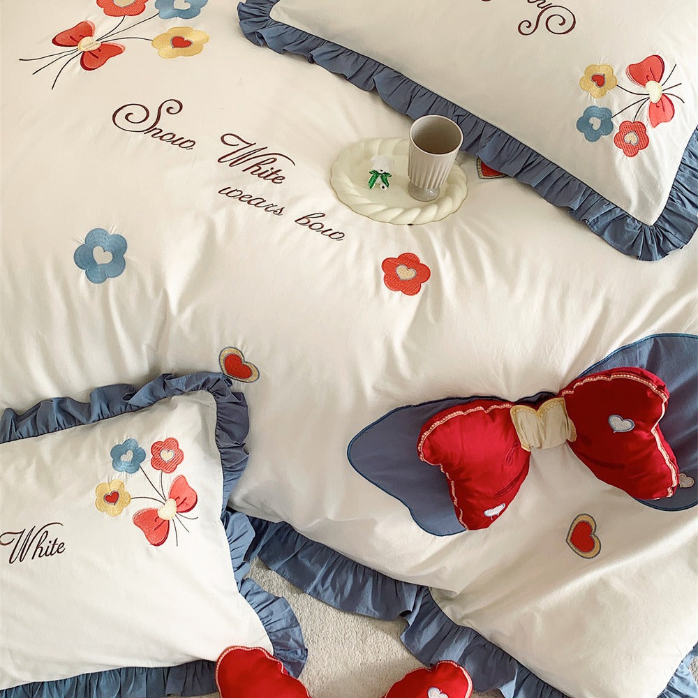 Ruffled Quilted Bedding Set with Embroidered Flower Appliqués and Decorative Bow Cushions