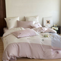 Satin Bedding Set with Delicate Floral Embroidery and Elegant Piping
